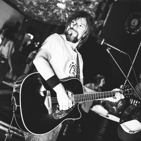 Travel Sings on the beach with santiago guitar